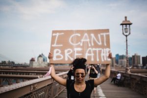 Woman Holding a Sign in Protest